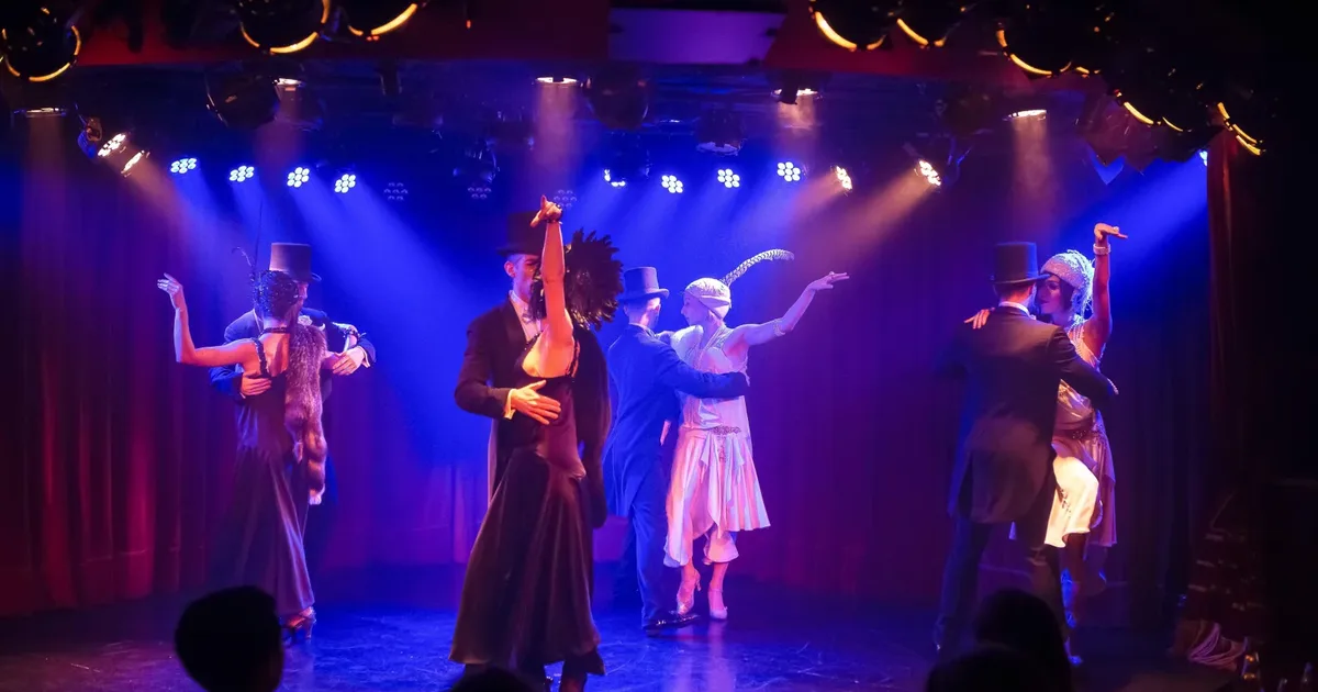 Rojo Tango dancers under blue and red stage light in El Cabaret, the small show room inside the Faena Hotel in Puerto Madero