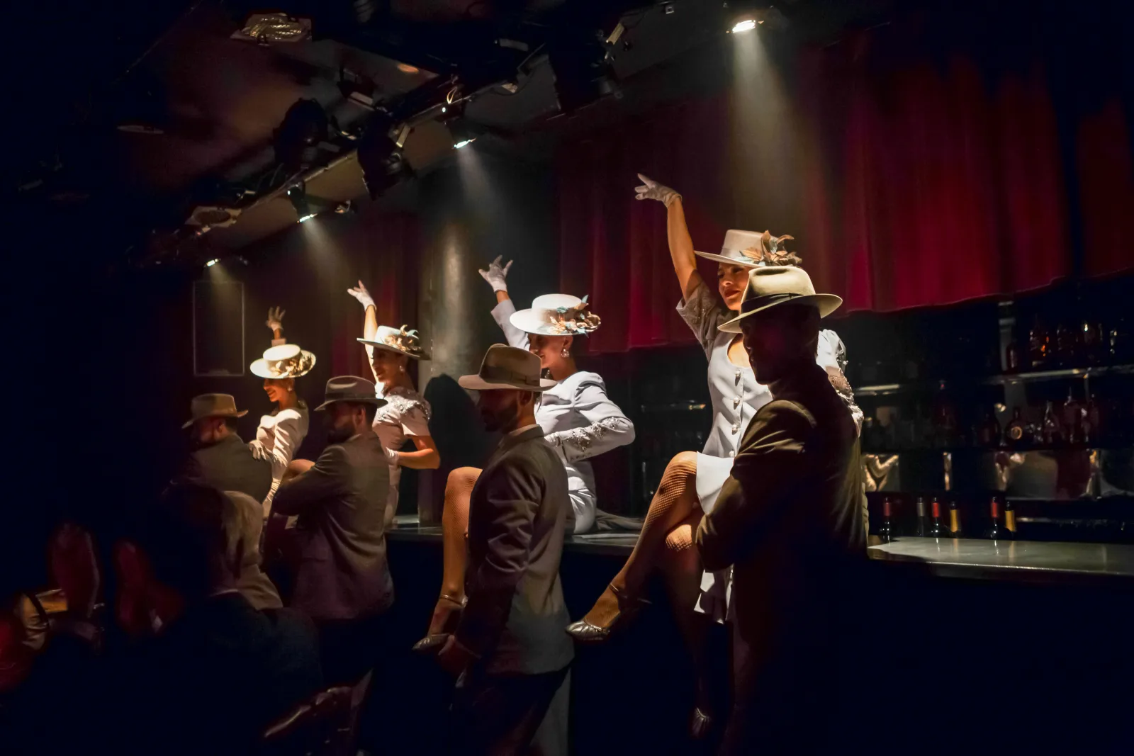 Rojo Tango performers in period hats and costume during a staged number