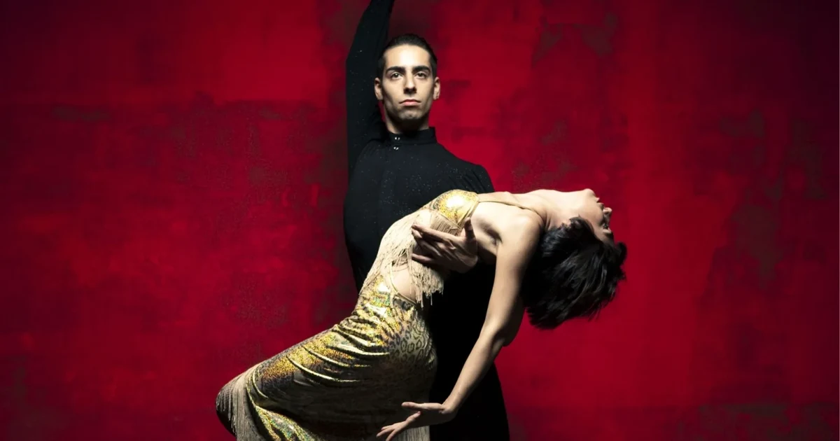Staged tango dip against a deep red wall, comparing the intimate Rojo Tango cabaret with the large Tango Porteño production